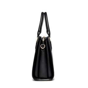Minimalist black lychee pattern leather tote bag with gold hardware in side view