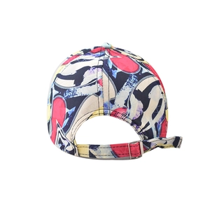 Detail of adjustable metal buckle and vibrant graffiti print on cotton baseball cap