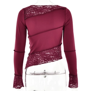 Detail of burgundy long sleeve top with lace patchwork and asymmetric hemline