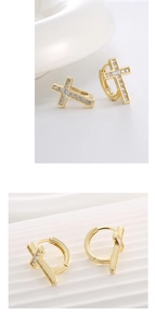 Macro shot of gold cross huggie earrings with S925 silver hallmark and pavé cubic zirconia
