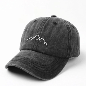 Washed dark grey baseball cap with minimalist mountain embroidery and vintage finish