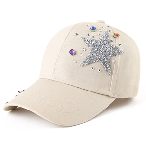 Beige baseball cap with sparkling sequin star and colorful rhinestones on white background