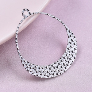 Close-up of silver 304 stainless steel hammered texture pendant with irregular round shape