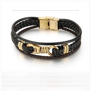 Macro view of multi-layer black leather braid and polished steel clasp on men's bracelet