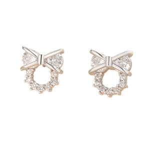 Elegant silver bow stud earrings with sparkling pear-cut zirconias on a white background