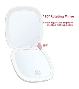 Detail view of the 180-degree adjustable hinge on a foldable LED makeup mirror