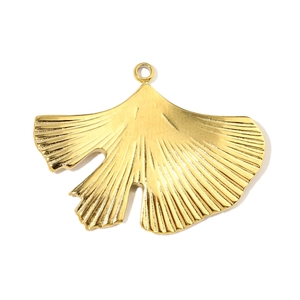 Detailed view of a golden ginkgo leaf charm with intricate vein patterns and metallic texture