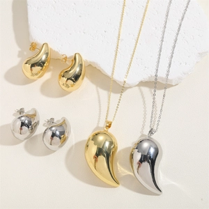 Polished teardrop pendant necklaces and earrings set in 14K gold and silver finishes