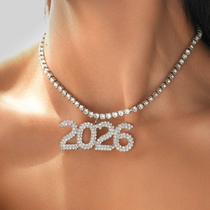 Close-up of sparkling 2026 pendant necklace with rhinestones on a tennis chain