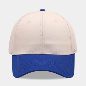 Detail of 6-panel cotton baseball cap with royal blue visor and beige twill fabric