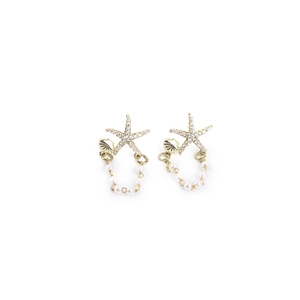 Detail of starfish stud earrings with white zircons, pearls and gold shell accents