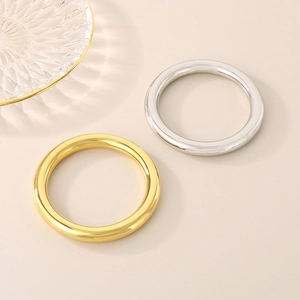 Polished hollow tube stainless steel bangles in gold and silver finish minimalist style