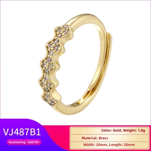 Detailed view of wave-shaped 18K gold brass ring with sparkling cubic zirconia inlay