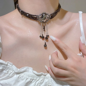 Gothic black beaded choker with oval gemstone and dangling silver fringe chains