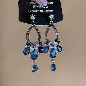 Luxurious Silver 925 blue sapphire teardrop pendant earrings with sparkling diamond accents