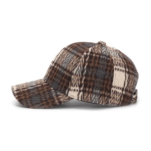 Close-up of vintage plaid tweed baseball cap fabric with retro brown check pattern
