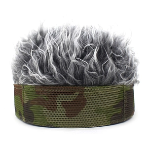 Detail of gray synthetic hair wig and camouflage mesh fabric on baseball cap surface