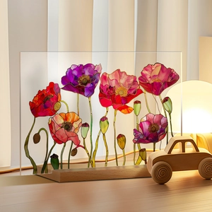 Detail of colorful acrylic plaque with 3D poppies and gold outlines on a wooden base