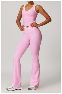 Detailed view of pink yoga set featuring a V-neck vest and flared high-waisted leggings