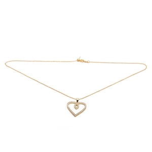 Elegant gold plated necklace with a sparkling heart shaped zircon pendant on white background