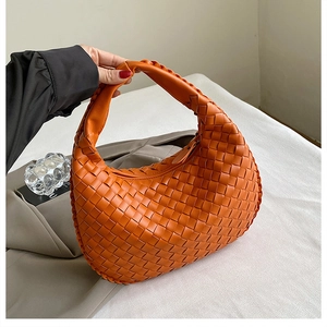 Chic orange woven PU leather hobo handbag featuring Intrecciato style for spring 2024
