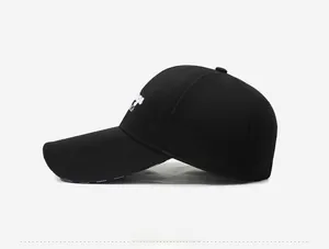 Detailed side view of black cotton baseball cap with white embroidery and Sport brim print