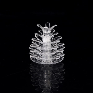 Macro shot of multi-layer clear acrylic pinecone LED light accessory on black background