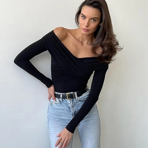 Detail view of the elegant criss-cross V-neckline on this black long sleeve bodysuit