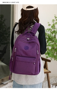 Deep purple water-resistant nylon backpack for women with multi-compartment design