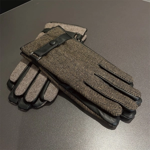 Men's winter gloves featuring brown herringbone wool and black leather with wrist strap