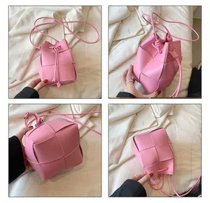 Detailed views of a pink woven bucket bag with leather texture and drawstring closure