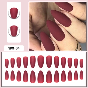 Macro detail of wine red matte almond press-on nails set with size distribution chart