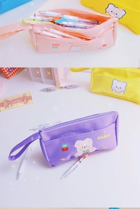 Detail of cute double-layer canvas pencil case with zipper and large storage capacity