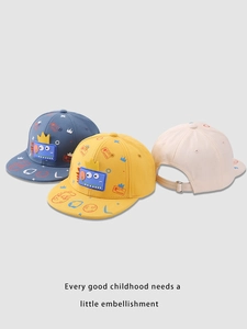 Detailed view of kids cartoon dinosaur snapback hats in blue, yellow and beige colors