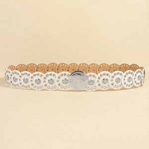 Close-up of white leather belt with ornate silver flower studs and metallic buckle