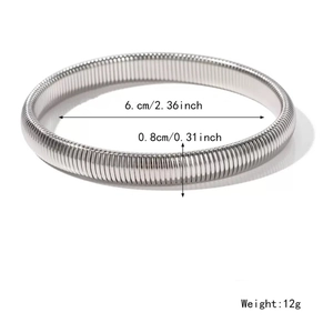 Silver stretch spring steel bangle bracelet with 6cm inner diameter and ribbed texture
