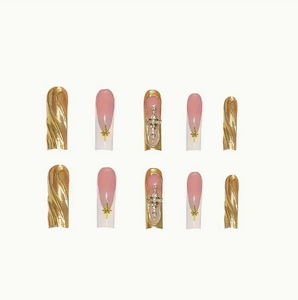 Golden gilt press-on nails set with 3D wave textures and cross charms in long coffin shape