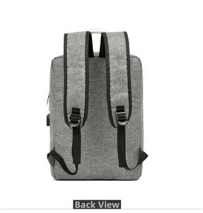 Reverse view of grey fabric backpack showing wide shoulder straps and side USB port