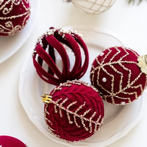 8cm burgundy velvet Christmas ornaments set with pearls and gold beads on white plate