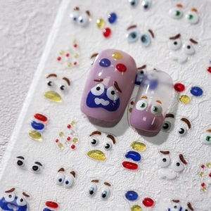 3D cartoon eye expression nail art stickers with colorful polka dots on pink nails