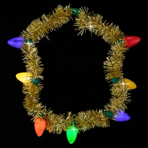 Detail of colorful vintage bulb necklace with festive tinsel on black background