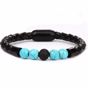 Detail of turquoise beads and black braided leather strap with magnetic metal clasp