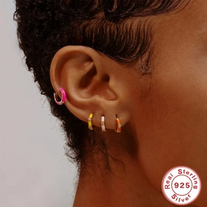 Colorful enamel S925 sterling silver hoop earrings with diamonds on model ear