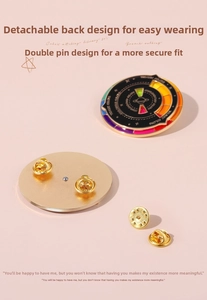 Macro view of rotating color wheel enamel brooch with gold finish and double-clasp back