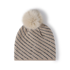 Beige striped winter beanie with soft fleece lining and a large faux fur pompom for warmth
