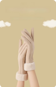 Detail of women's beige thermal gloves with white faux fur cuffs and touchscreen fingertips