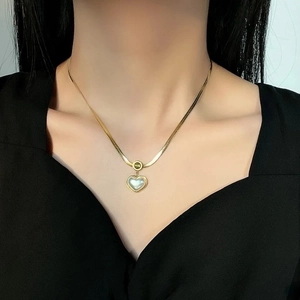 Minimalist gold titanium necklace featuring a white pearl heart pendant for women