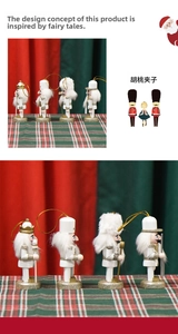 Detail of four 10cm white and gold nutcracker soldier ornaments with hanging ropes