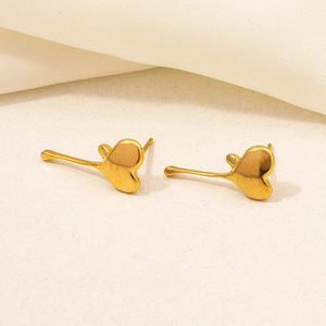 Minimalist gold 304 stainless steel heart earrings with curved metal drops on beige background