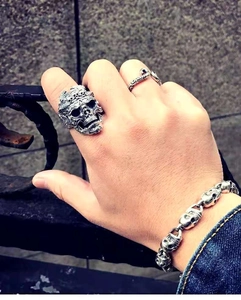 Gothic punk style silver skull ring and bracelet set worn on hand for men